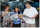 Description: USP journalism head Shailendra Singh and students check out the latest Wansolwara. Photo: USP