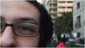 Ahmed Basiony, Self portrait with mobile phone, Tahrir Square, 2011.